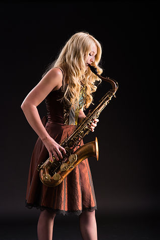 Saxophonist Laura is trained classically in both saxophone and piano.