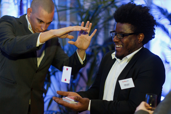 Magician Matt performs his close up magic at a corporate event.